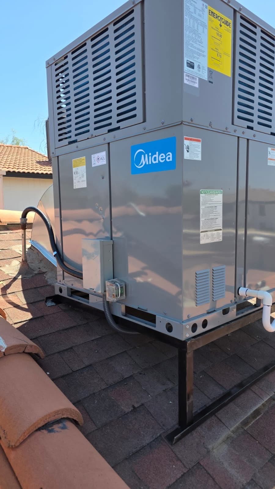 Midea rooftop HVAC package unit installed on a Tempe, Arizona property